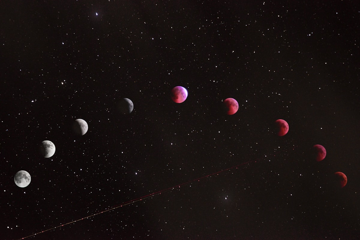 Phases of a lunar eclipse across the night sky